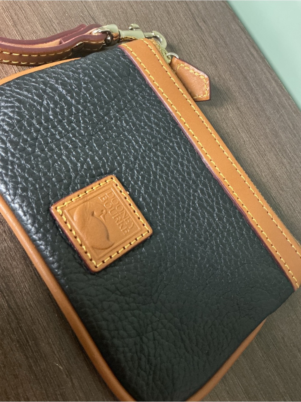 Dooney & Bourke Black Pebbled Leather Wristlet with Tan Trim and Strap